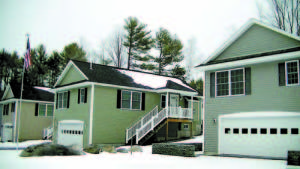 DURING A TOUR of the gated community, Casco Planning Board members saw homes in stages of development along Deer Run at Point Sebago Resort. (De Busk Photo)