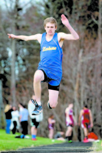 NICK SCARLETT takes off during triple jump action in last Friday's meet in Naples.