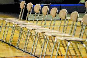 FEW IN ATTENDANCE â€” Although 100 chairs were set up in the Lake Region High School gym and bleachers were pulled, most seats went empty at Tuesday's district budget meeting. (Rivet Photo)