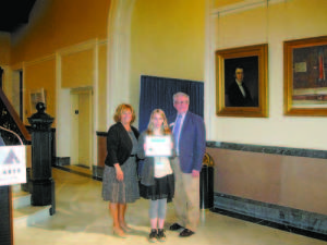 EXCELLENCE IN ART â€” Ashley Kilgore was honored by Maine's First Lady Ann LePage and Maine Arts Commission chairman Charles Stanhope at the State House.