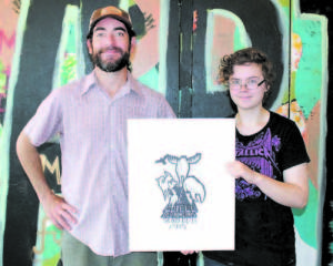 WINNING DESIGN — Phoebe Crowe (right) of Lovell produced the winning logo for this year's Lovell Old Home Days road race. She is pictured with Fryeburg Academy art teacher Steve Pullan.