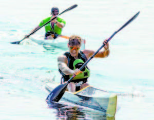 RECORD SETTER Kris Freeman, an Olympic nordic skier, pulls away in the kayak portion of the Great Adventure Challenge triathlon. (Photo by Sheila Weeman)