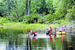 MILFOIL FIGHTERS Derrek Douglass, Christian Oren and Thomas Chagrasulis.