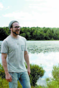 After spending the summer clearing the trails at Holt Pond Preserve, volunteer Ryan Curtis feels this is his second home. (Photo by Maverick Roy)