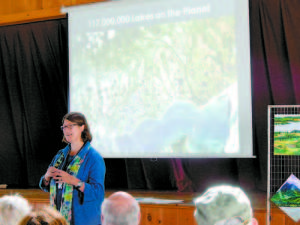LISA BORRE â€” lake researcher from the Cary Institute of Ecosystem Studies, addresses the crowd at this yearâ€™s Maine Lakes Conference at Camp Skylemar in Naples. (Geraghty Photo)