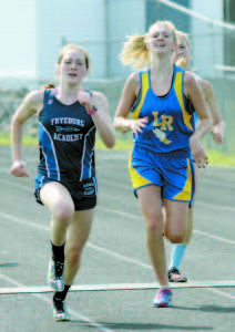 Battle to the Wire between Olivia Thompson of Fryeburg Academy (left) and Addie Blais of Lake Region during Saturday's Lake Region Invitational cross-country meet. (Rivet Photos)