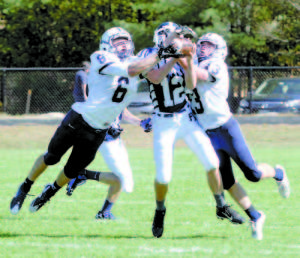 BALL UP FOR GRABS â€” Fryeburg Academy defensive back Oscar Saunders found himself in the middle of Yarmouth's Jack Snyder (left)  and Noah Colby-George trying to catch the ball Saturday. Snyder came up with the ball, and the Clippers rolled against the Raiders. (Rivet Photo) YARMOUTH 48 RAIDERS 12 First Downs: FA 7, YAR 9 Penalties: FA 4-30, YAR 4-55 Turnovers: FA 1, YAR 2 Rushing: FA 29-30, YAR 38-368 FA rushing: Ryan Gullikson 20-21, Jared Chisari 9-9 YAR rushing: Henry Venden 7-33, Lucas Uhl 9-30, Harry Steinharter 1-4, Jack Snyder 10-59, Cody Cook 6-174, Remi Leblanc 5-68 Passing: FA 3-19-115, YAR 4-9-75 Total offense: FA 145, YAR 443 FA defense (solo, assist, total tackles): Tucker Buzzell 1-0-1, Kevin Ventura 0-1-1, Alex Ehrenssberger 1-4-5, Matt Boucher 4-2-6, Gage Fowler 2-3-5, Baha Demir 1-2-3, Ryan Gullikson 0-1-1, Scott Parker 1-1-2, Jared Chisari 1-0-1, Isaac Wakefield 1-1-2, Cody Gullikson 1-1-2, Nick Lâ€™Heureux-Carland 0-2-2, Cobey Johnson 1-0-1, Caleb Bowles 1-0-1, Oscar Saunders 2-1-3 Up next: The Raiders (1-3) travel to Freeport Saturday for a 1:30 game against the Falcons (0-4). Freeport lost last week to Cape Elizabeth 56-12.  
