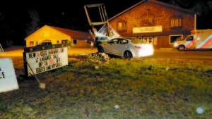FINALLY STOPPED â€” A high speed chase ended when a stolen car struck the R.G. Johnson Sporting Goods sign off Route 302.