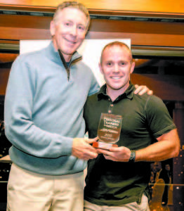 GLOBALLY RECOGNIZED â€” Greg Johnson, formerly of Sebago and current resident of Sacramento, Calif. (right), receives the 2015 Life Fitness Trainer to Watch award from the organization's president, Chris Clawson. Some 1,000 candidates from across the globe were nominated for the honor.