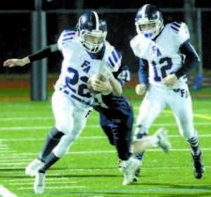 Raider running back Jared Chisari looks to stay inbounds with a Clipper trying to trip him up.