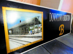 The Depot Street Train Station was chosen for the main ground sign directing visitors to the downtown because â€œItâ€™s part of the history of this town,â€ said signmaker Nelle Ely. She said she was given the style of the letter â€œB,â€ denoting Bridgton, by the town for use on all of the signs.  