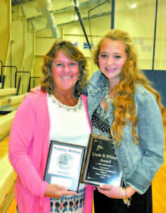 Nicole Thurston holds the Linda B. Whitney Award for being selected the WMC top field hockey player. She is pictured with FA varsity field hockey coach Dede Frost, who is holding Nicole's Raider plaque.