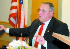 GOV. PAUL LEPAGE uses his hands to illustrate an idea he was expressing during a town hall meeting in Bridgton on Jan. 6. (De Busk Photo)