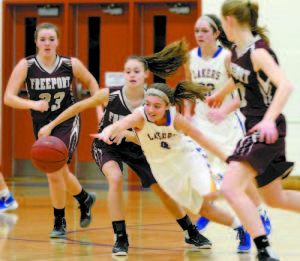 Kristen Huntress of Lake Region dives to gain control of a loose ball against Freeport. (Rivet Photo)