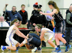 KEY TIE UP â€” Kristen Huntress (left) and Lauren Jakobs forced a tie up and jump ball call, giving the Lakers possession late in the game â€” a mistake later detected at the scorer's table.