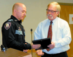 HE DIDNâ€™T HESITATE â€” Bridgton Police Officer Todd Smolinsky was formally recognized Tuesday by Selectman Chairman Bernie King for saving a person from committing suicide last fall. Smolinskyâ€™s life-saving actions were honored by the Maine Chiefs of Police Association at their recent annual winter meeting. (Geraghty Photo) 