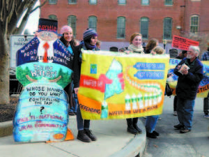 ITâ€™S OUR WATER â€” After packing an inside courtroom, some of the over 100 Fryeburg residents and members of Community Water Justice stood with protest signs outside the entrance to the Cumberland County Courthouse in Portland Tuesday. They believe Fryeburgâ€™s water supply is being put at serious risk under a long-term contract between NestlÃ© Waters of North America and the Fryeburg Water Company, and want the Maine Supreme Court to reject the Public Utility Commissionâ€™s approval of the contract. The Justices heard legal arguments and questioned both sides, and will rule on the case at a later date. 