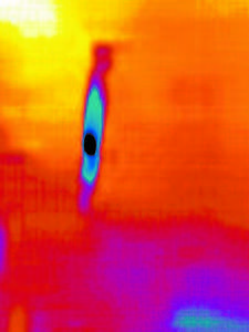 PRESENCE IN THE ROOM? This image was photographed facing a doorway inside the Admiral Peary Inn. The blue and black of the object means that it is colder than the area around. It's approximate height is 5'6'' to 5'10."