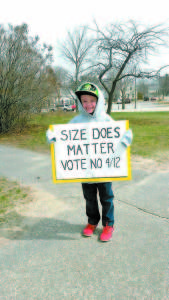 The Friends of Sebago Elementary gathered in Bridgton on Sunday afternoon to spread their message of opposition to the current CRES proposal. Many gathered at the intersection with signs and fliers to let people know that they support the students, but believe a faster, less expensive solution is possible to alleviate the overcrowding at Songo Locks School. Their message: “Vote No on April 12! End overcrowding now, not two years from now!â€
