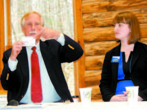 ITâ€™S IN THE CARDS â€” U.S. Sen. Angus King holds up a card he said he passes out to people whenever he can to urge action on climate change. (Geraghty Photo) (panelists with peter Lowell) THIN ICE â€” Lakes Environmental Association Executive Director Peter Lowell, standing, introduced the speakers at a â€œFishing on Thin Iceâ€ forum on climate change held Monday at the Maine Lake Science Center. From left are U.S. Senator Angus King, Laura Dorle, Environment Maine Campaigns Director, Zach Wozich, Vice President of the Sebago Lake Anglers Association, Dr. Bruce Taylor, Sweden Selectman and a member of Physicians for Social Responsibility and David Miller, President of the Sebago Chapter of Trout Unlimited. (Geraghty Photo) (crowd shot) Around 75 people attended a â€œFishing on Thin Iceâ€ forum on climate change held Monday at the Maine Lake Science Center in Bridgton. (Geraghty Photo) 