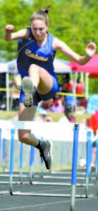MAGGIE LUCE clears a hurdle during the WMC Championships.