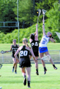 Lauren Jakobs of Lake Region leaps high to gain possession of the ball.