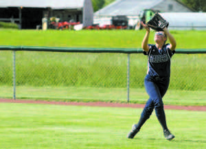 Chloe Coen tracks down a fly ball in right field.