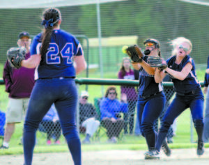 A gusting wind proved troublesome for third baseman Faith Pelkie and shortstop Tina LeBlanc as the two collided and the ball dropped.