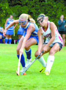 JULIA MURCH (left) fights for the ball against Freeport. (Photo by Dena Dunn)
