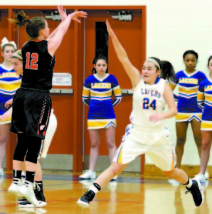 Aisley Sturk hustles out to defend a jumpshot.