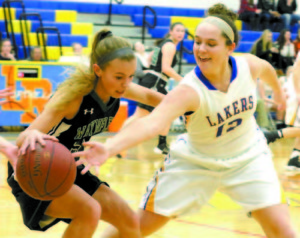 Senior Melody Millett looks to tip the ball away on the Laker press.