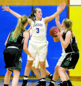 Sophomore forward Brooke Harriman blocks the path to the hoop.